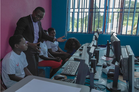 Frank Ategeka facilitating a session on internet for adolescent girls and women (beneficiaries of the Rural Aid Foundation digital rights project)