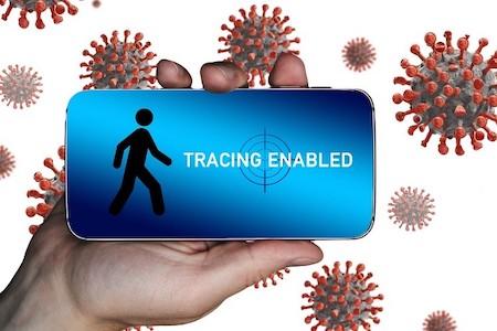 Person holding a mobile phone with a screen that indicates contact tracing is taking place