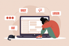 A woman cries in front of a computer screen surrounded by words "ugly," "fat," and "loser."