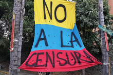 A banner saying "No to censorship".